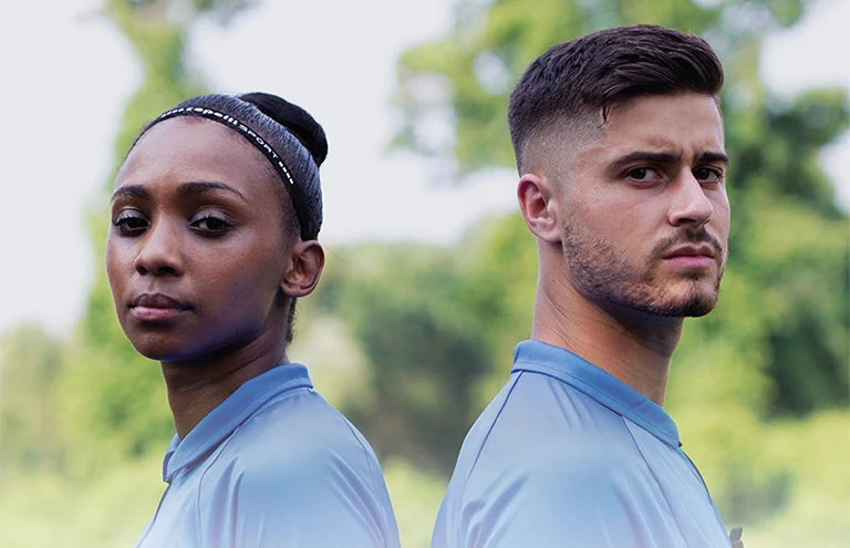 Two soccer referees in US Officials kit