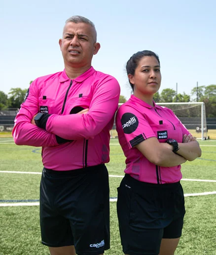 Two US Officials referees on the field