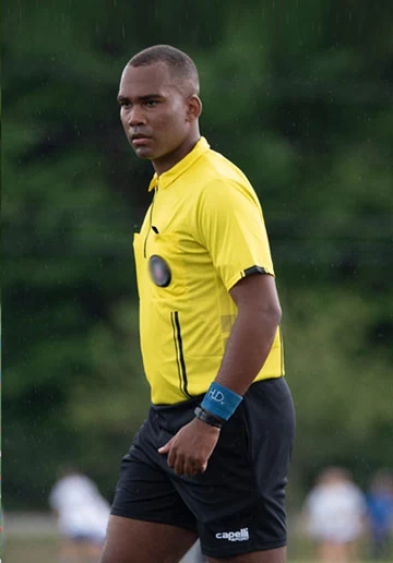 A referee officiating in the rain